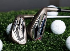 King Cobra Darkspeed Irons, - Pic of two irons and golf balls.