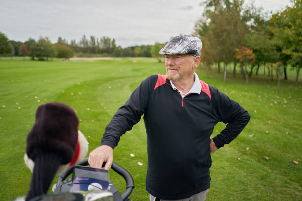 Golf equipment for seniors - pic of a senior waiting to hit his golf ball.
